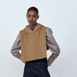 Sweater vest with slits